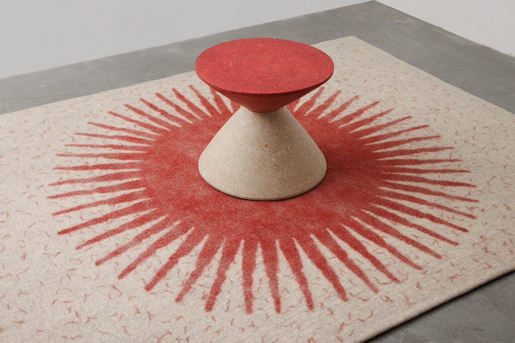 Handmade felt rug and Honarvar Sculptural Side table presented By Aassttiinn.com
