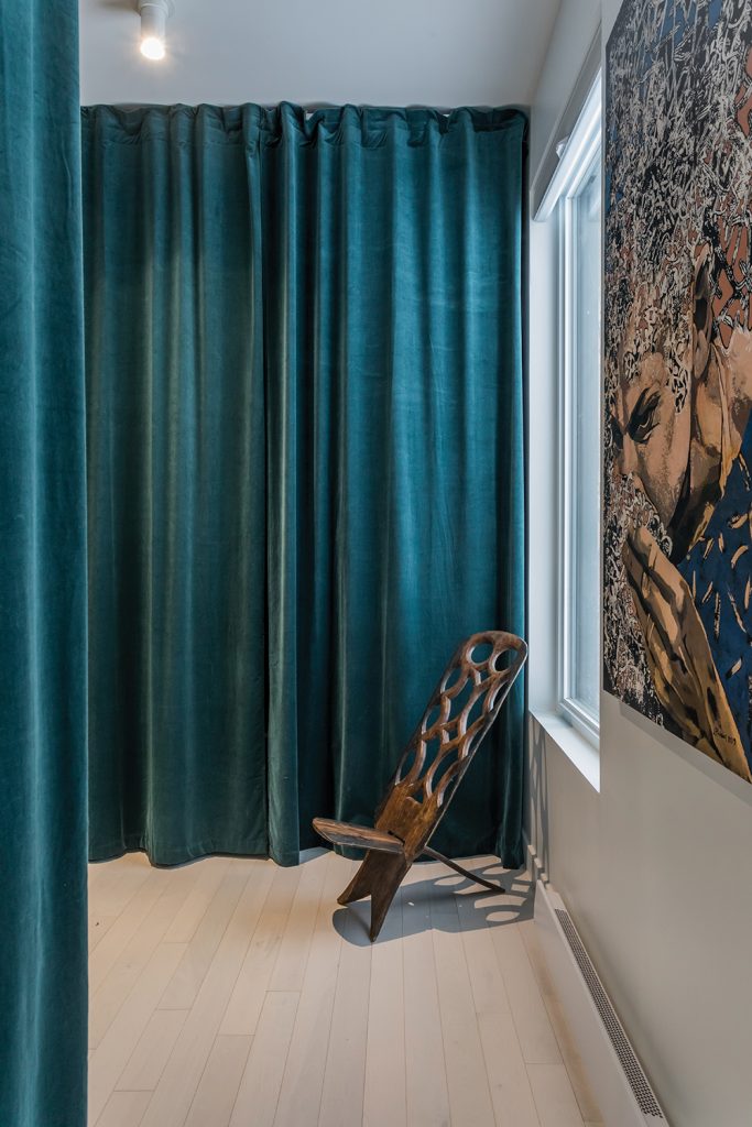 The curtains add a theatrical touch to the space
