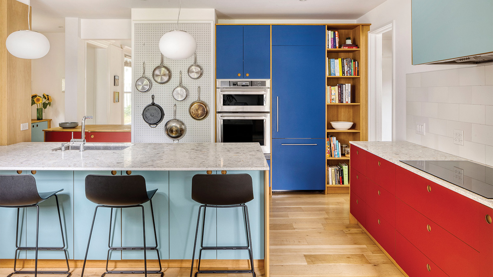 The kitchen is designed with splashes of colours