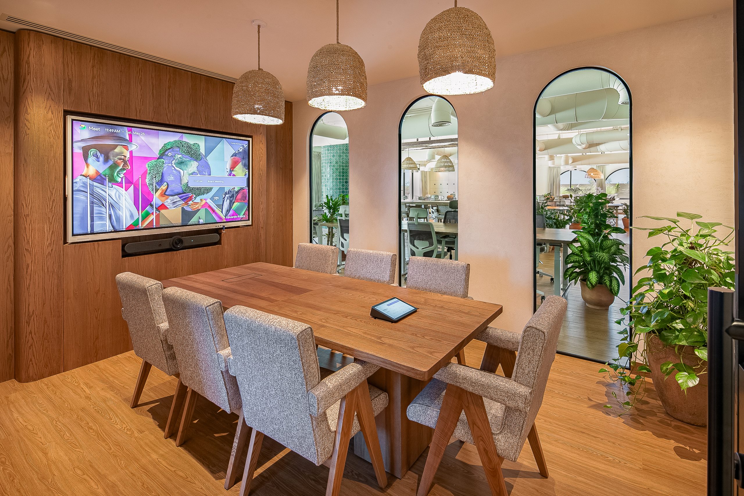 Boardroom with arched mirrors and warm toned furniture