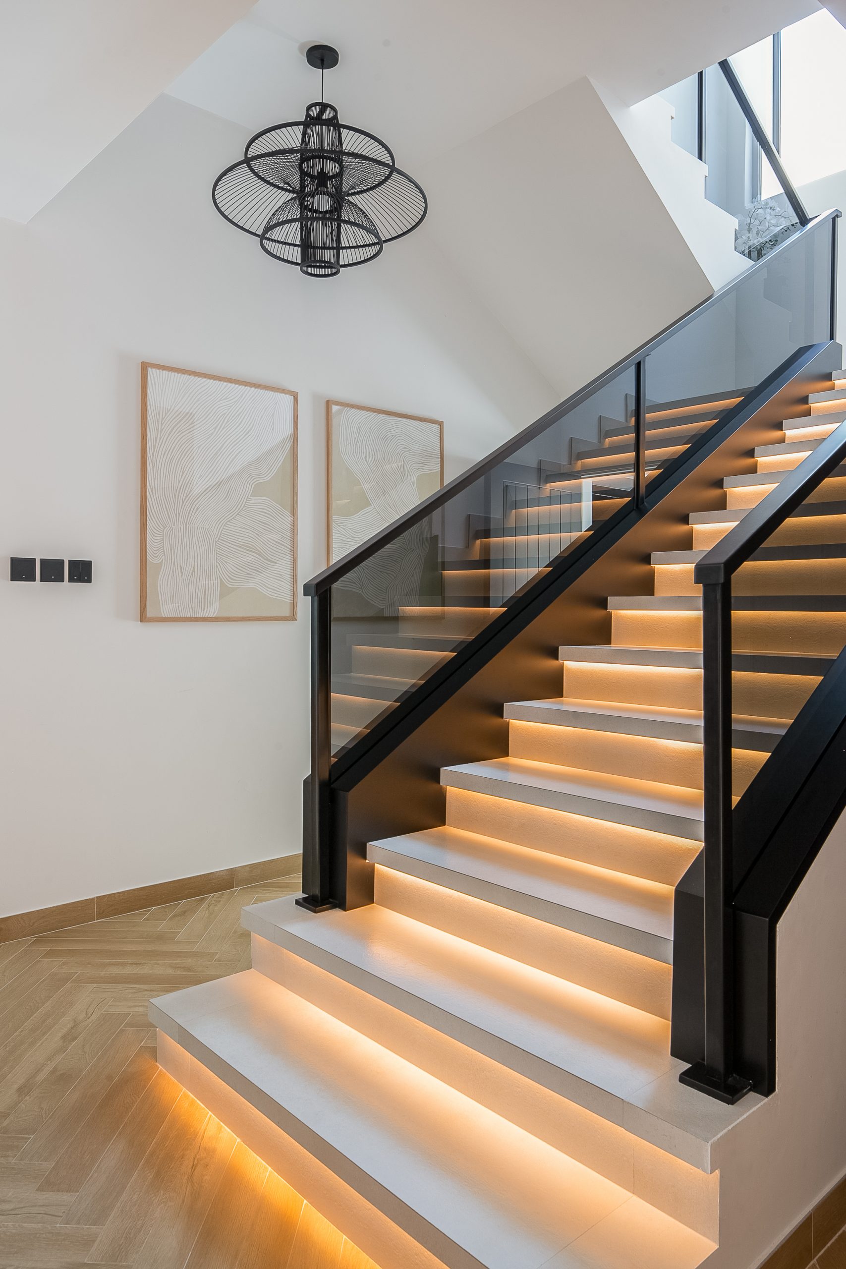 A staircase with lights on the sides