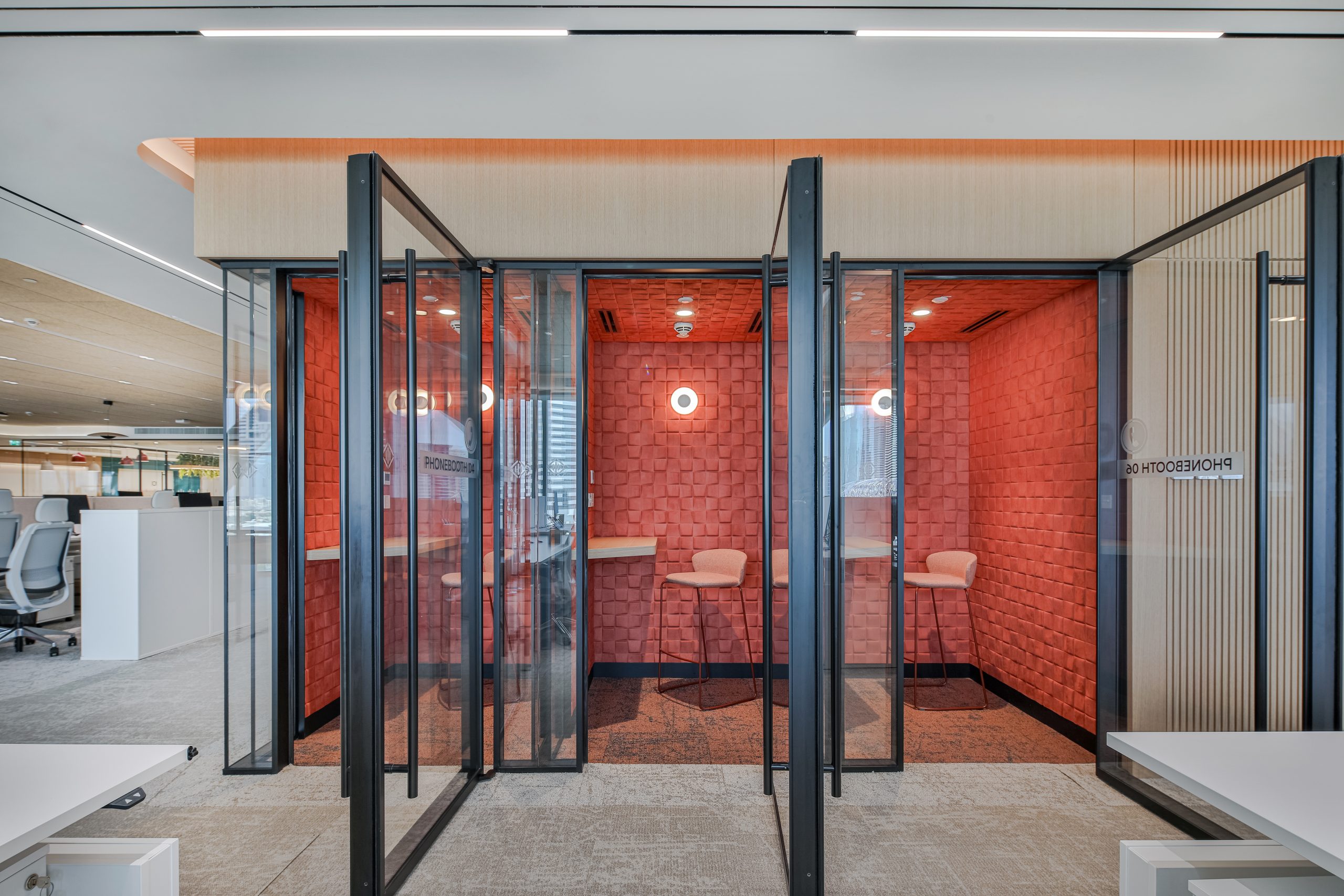 glass doors to a private work room decorated in red