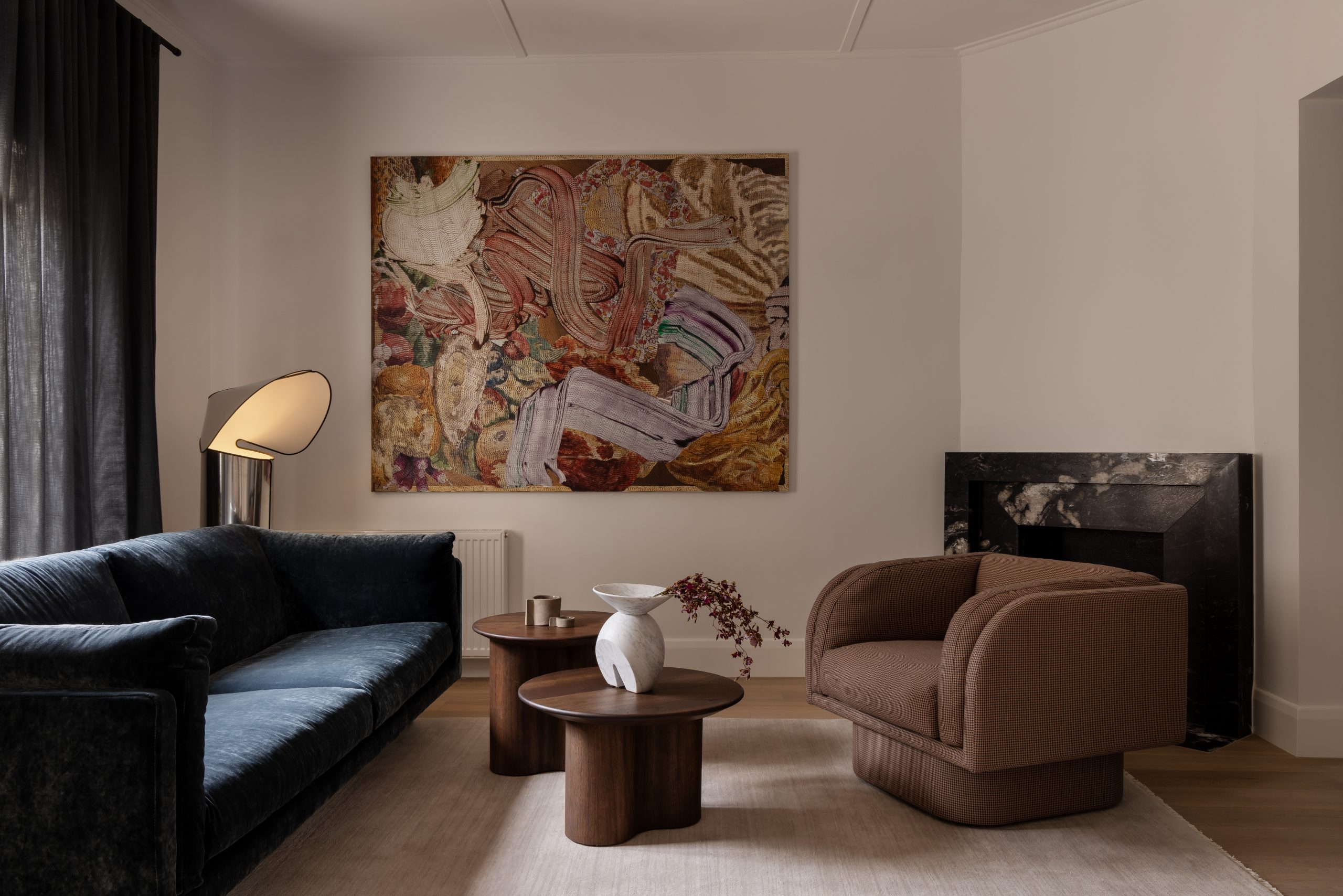 living room with rich jewel toned furniture and artwork by Gregory Hodge 