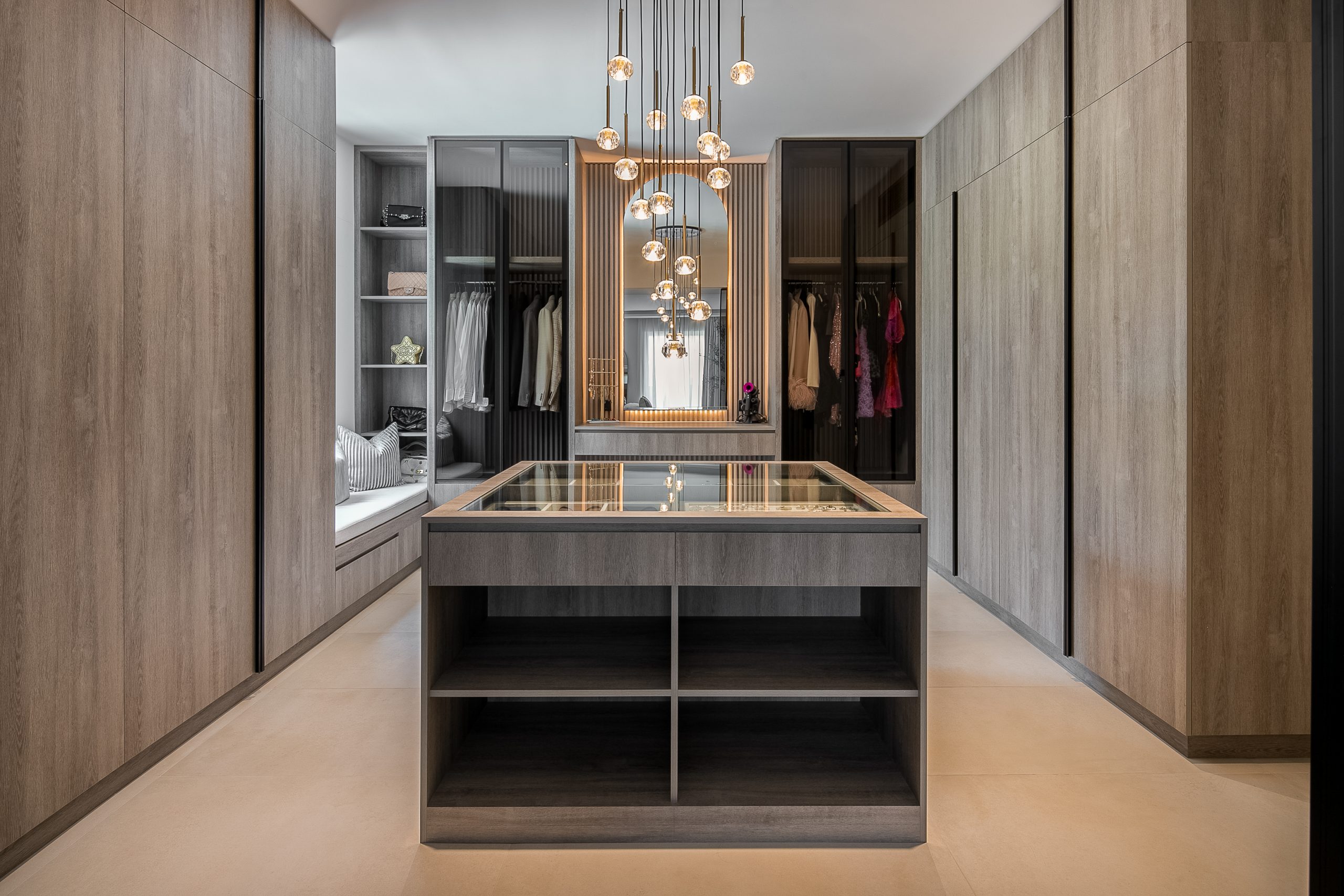 A large walk in closet with a chandelier