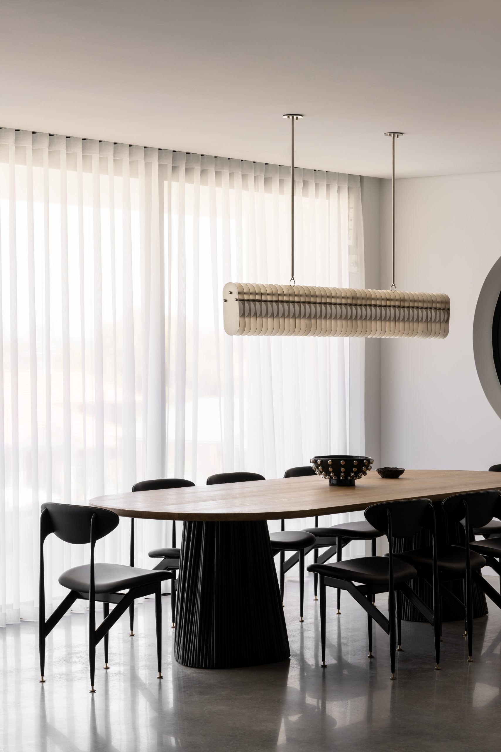 custom-made, black dining table by Jack Flanagan at the woodland home