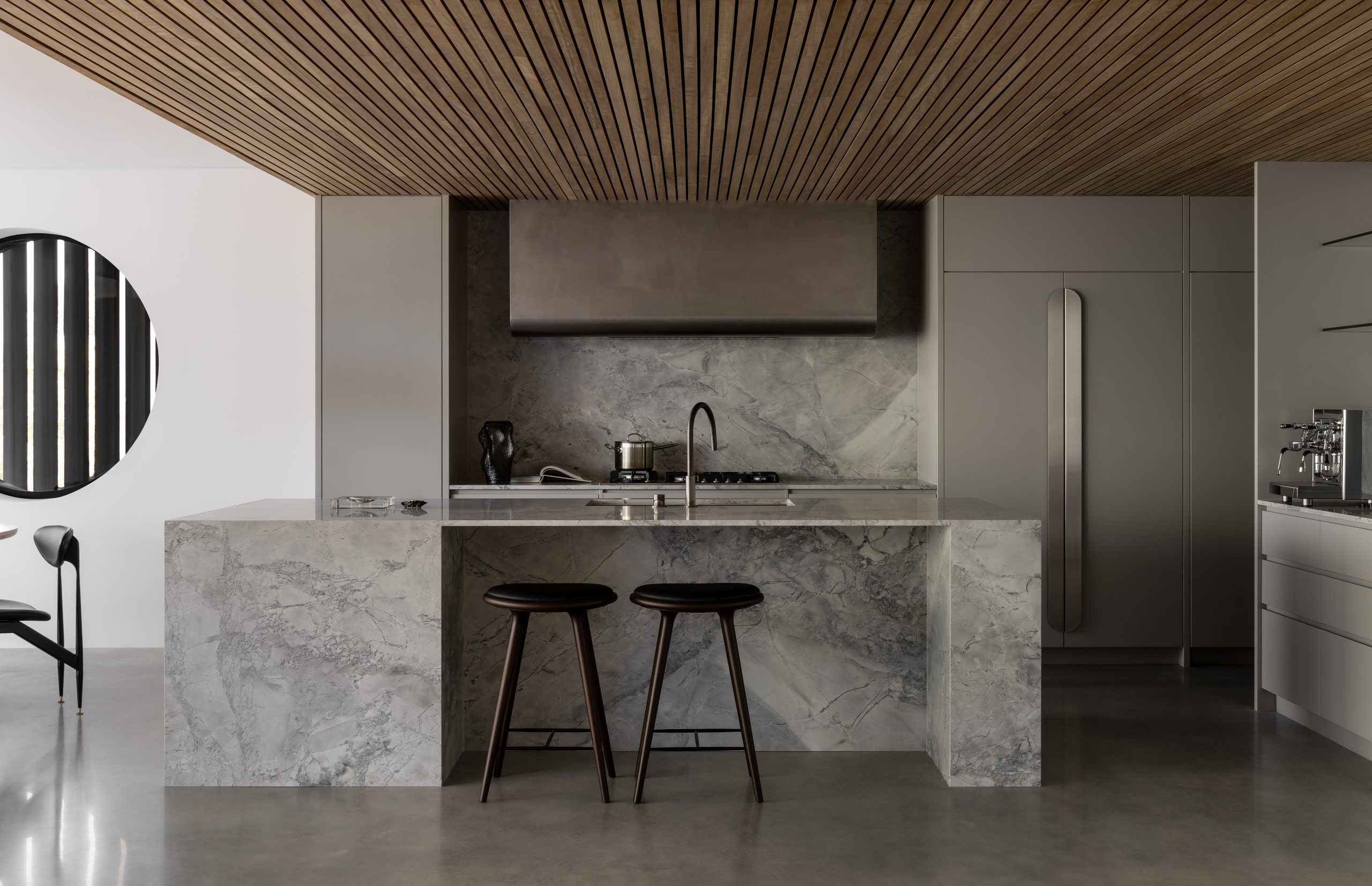 darker grey kitchen with marble finishing and minimalist design