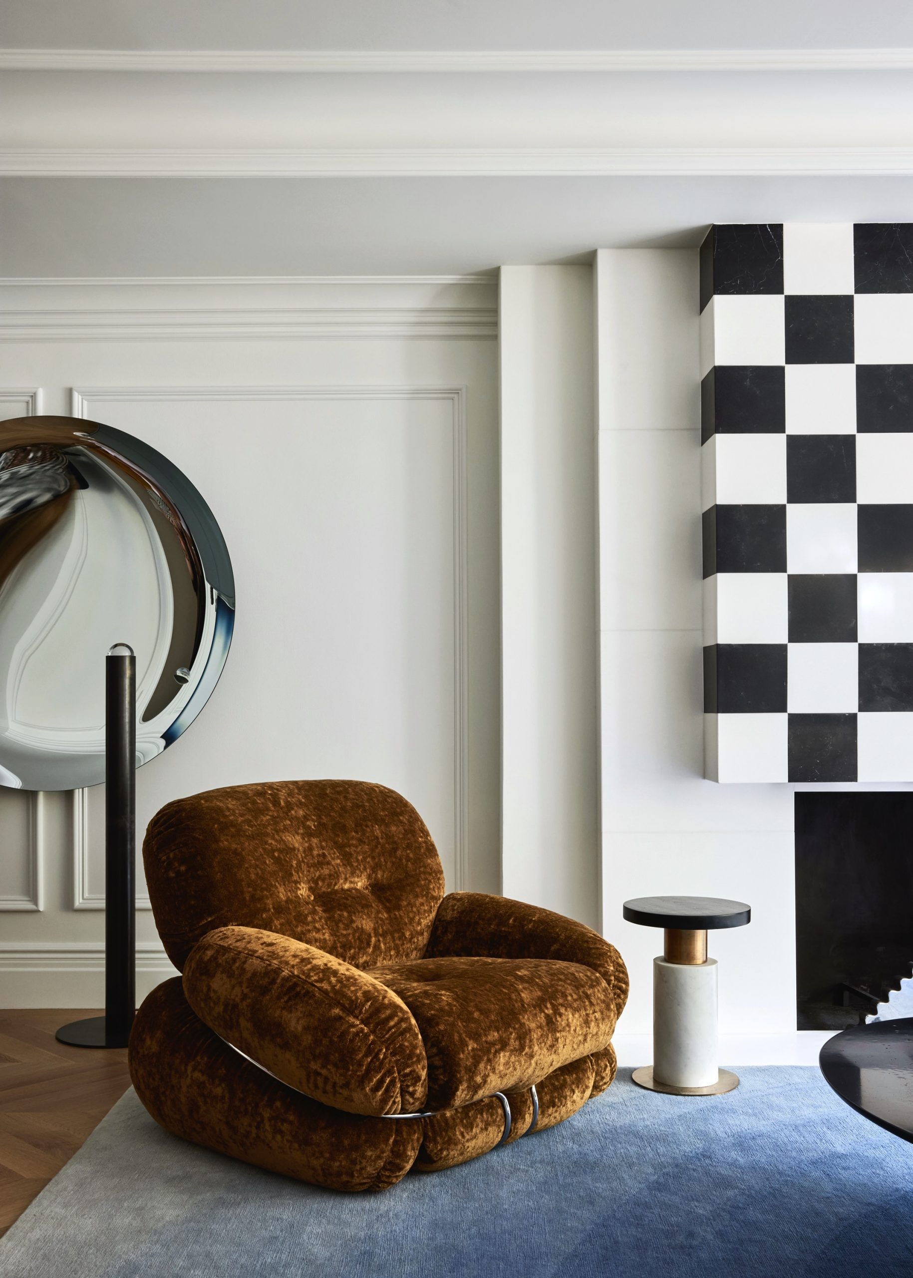 A brown chair in the 955 fifth avenue living room