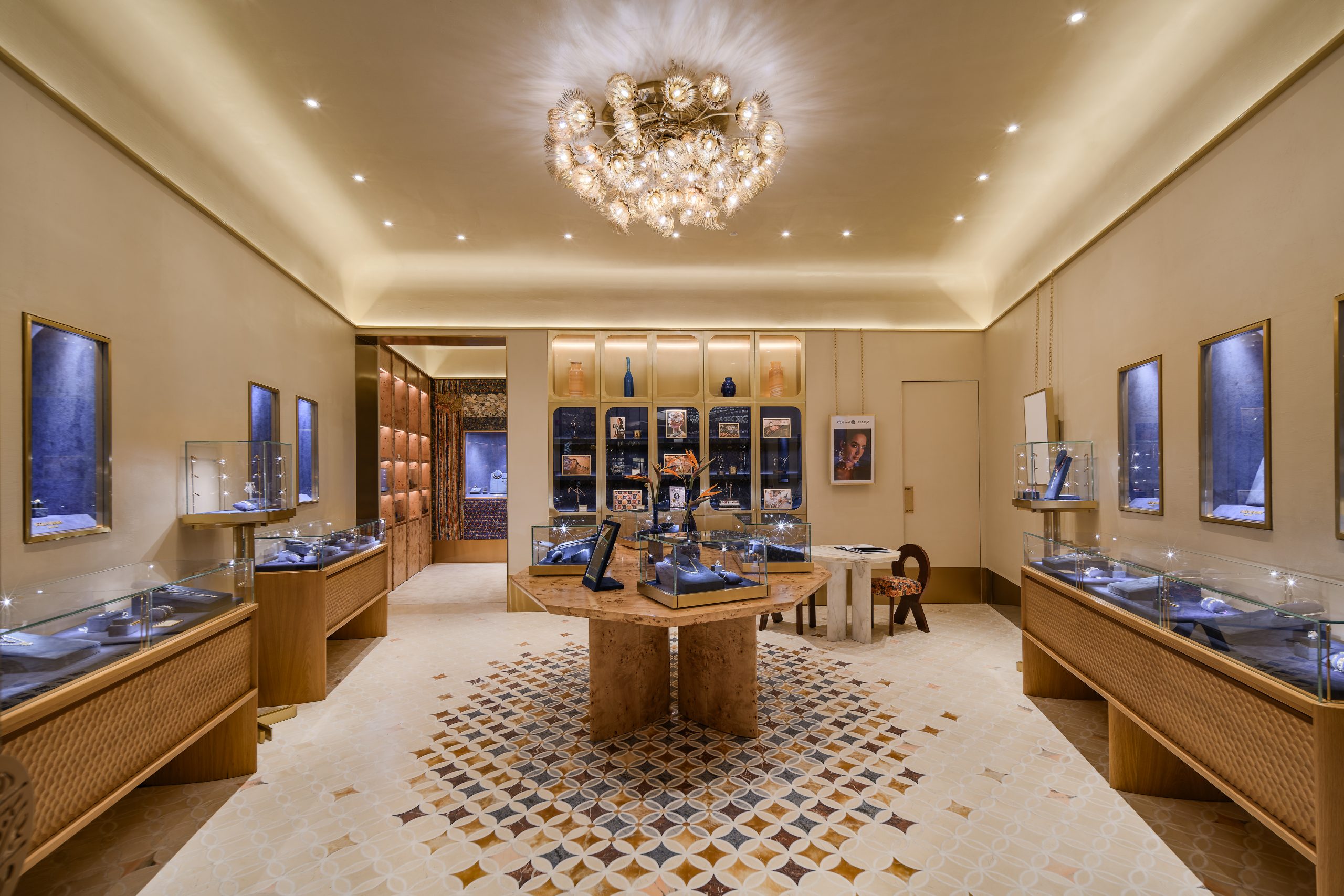 azza fahmy boutique with jewellery stands, a chandelier and warm toned palette 