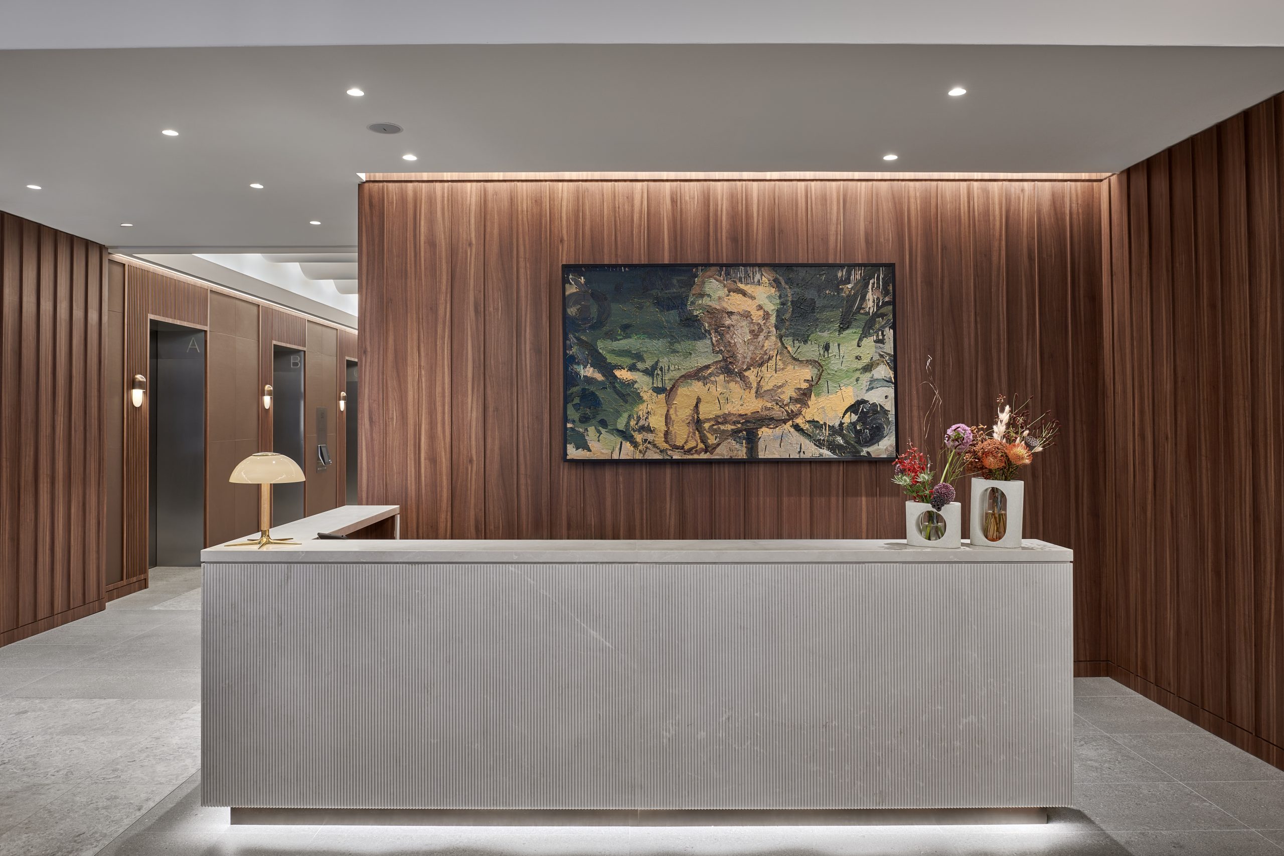 A reception desk with Venuses & Aphrodites, an acrylic piece by Lebanese artist Taghreed Darghouth